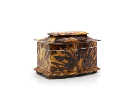 A Regency tortoiseshell tea caddy c.1820, the hinged bow front lid concealing two lidded compartments, the inner edges veneer