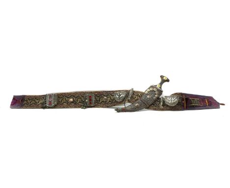 An Omani khanjar and belt,  20th century, with attached accouterments, 127cm overallthe dagger 40cm