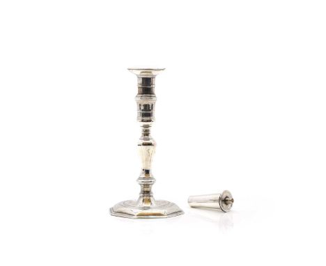 A George III Irish silver candlestick,  the sconce with an engraved crest of a dog holding a crown, and a burner, 19.5cm high