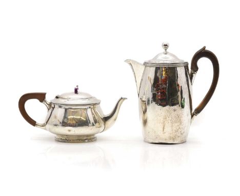 A George III silver hot water pot London 1790,23cm hightogether with a silver teapot, by Mappin &amp; Webb, Sheffield 1931,23