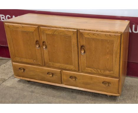 An Ercol Blonde elm Windsor sideboard