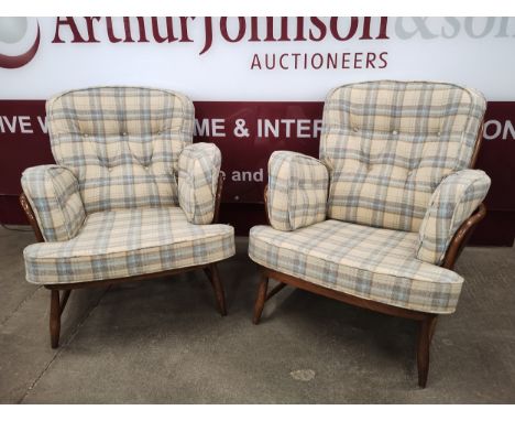 A pair of Ercol Golden Dawn beech Windsor armchairs