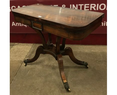 A Regency rosewood and brass inlaid D-shaped fold over games card table