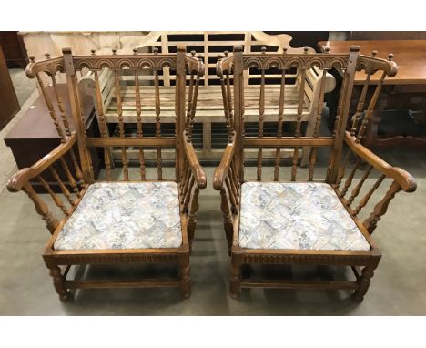 A pair of Ercol Old Colonial ash armchairs