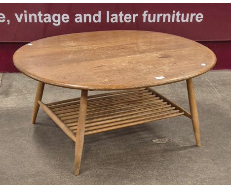 An Ercol Blonde elm and beech oval Windsor coffee table