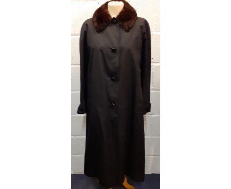 Aquascutum-A vintage Aqua 5 ladies full length black raincoat with brown mink collar and black faux fur lining with 4 black s
