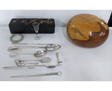 Silver plated flatware to include a basting spoon, Stilton scoop and marrow scoop, a black lacquered and gilded glove box, a 