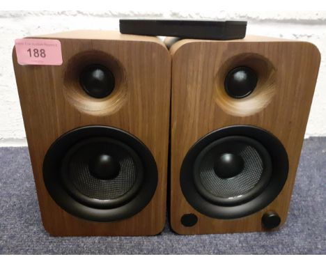 A pair of Kanto walnut cased powered speakers with bluetooth and built-in phono pre-amp, 140W Class D amplifier, 1" silk dome