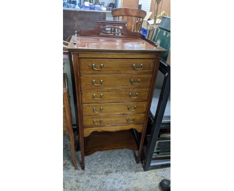 Edwardian inlaid mahogany music cabinet of five drawers over an undertier, on square tapering legs, a French  marquetry walnu