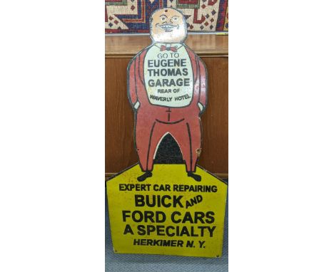 A late 20th century 'Eugene Thomas Garage' enamel advertising sign, 91cm x 44cmLocation:A4B 