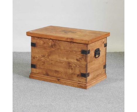An iron bound pine trunk, with a hinged lid72 x 45 x 49h cm