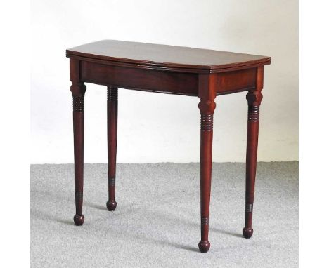 A mahogany folding card table, on turned legs84w x 41d x 77h cm