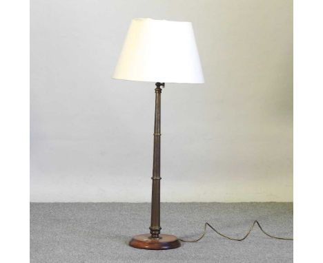 A 19th century brass table lamp and shade, on a later wooden base104cm high
