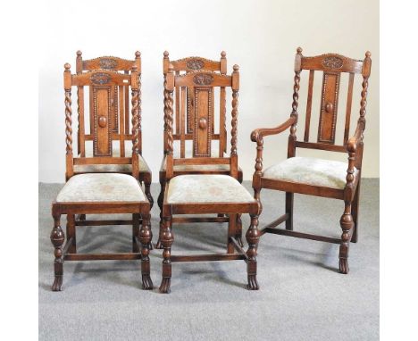 A set of five early 20th century light oak dining chairs, with barley twist supports and cream floral padded seats, to includ