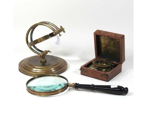 A reproduction sundial compass, together with a table magnifying glass and a hand magnifying glass, 36cm long (3)