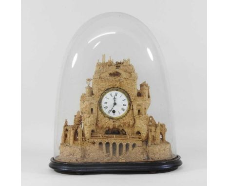 A 19th century finely carved cork mantel clock, the case decorated with Culzean Castle and ruins, inset with a white enamel d