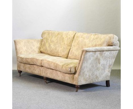 A Duresta cream upholstered three seat sofa, on turned legs223w x 106d x 95h cm