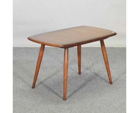 An Ercol elm occasional table, on a splayed base72 x 44 x 45h cm