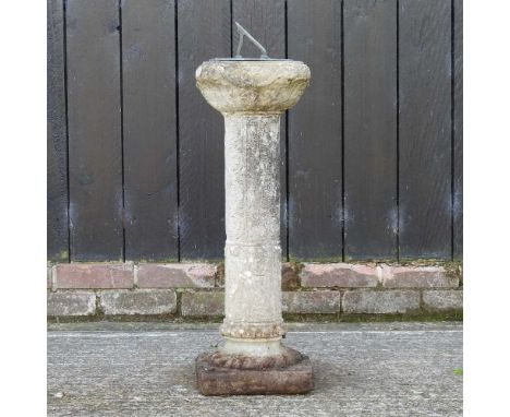 A reconstituted stone sundial, with relief decoration80cm high