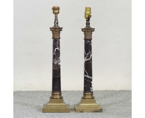 A pair of marble table lamp bases, each in the form of a corinthian column, with brass mounts59cm high