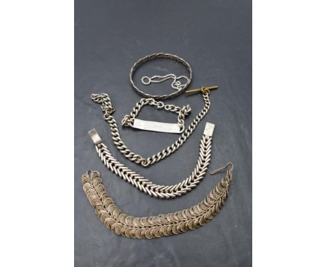 Four pieces of HM silver and white metal including bracelets, bangle and watch chain