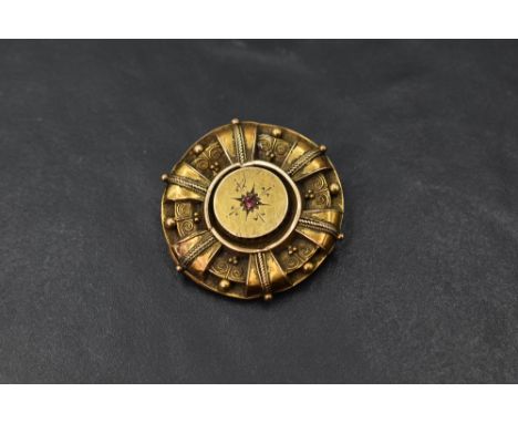 A Victorian 15ct gold brooch having ruby chip and wire decoration, approx 6.3g  (AF)