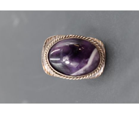 An oversized Blue John ring having an oval stone in a collared mount on stylised white metal loop, size R &amp; approx 13.5g