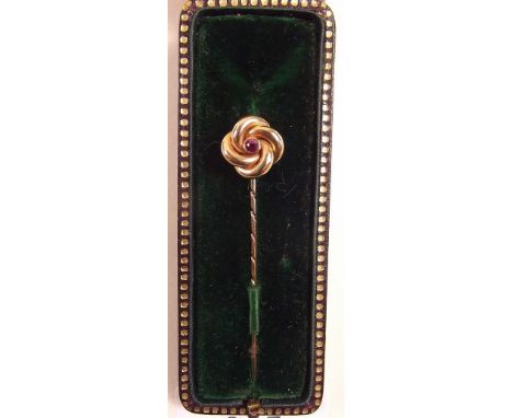 A 9 carat gold stick pin set ruby - cased