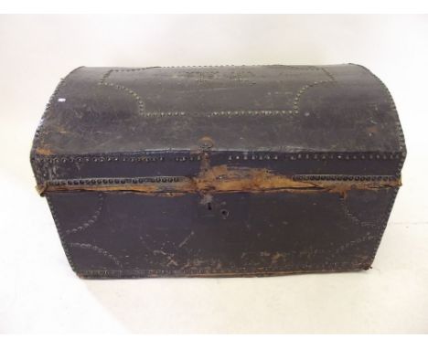 A Victorian dome top leather trunk 