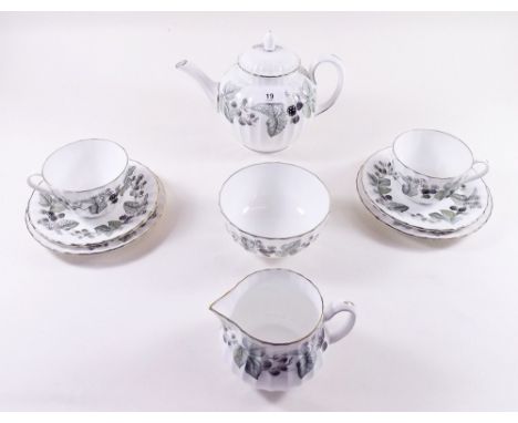 A Royal Worcester Lavinia tea set comprising: teapot, twelve cups and saucers, twelve tea plates, cake plate, milk and sugar 