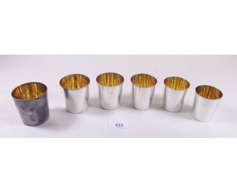 A set of six silver  stirrup cups with gilt interiors, 10ozs - Birmingham 1950 in leather case