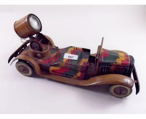 A tin plate clockwork army searchlight truck with camouflage paintwork - good condition 