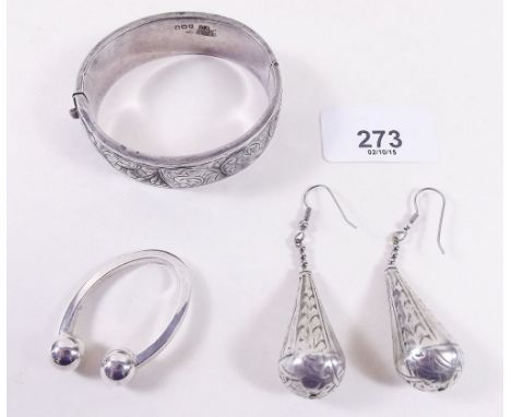 A silver keyring, bangle and earrings 