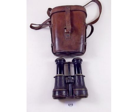 A pair of sporting binoculars with integral compass