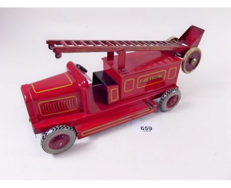 A Chad Valley tin plate clockwork fire engine, complete with ladder - good condition 