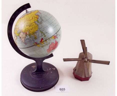 A toy globe and a painted metal windmill
