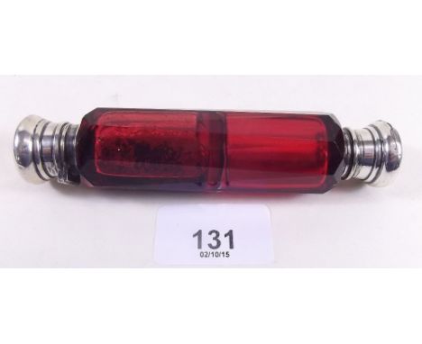 A Victorian ruby cut glass double ended scent bottle with silver plated ends