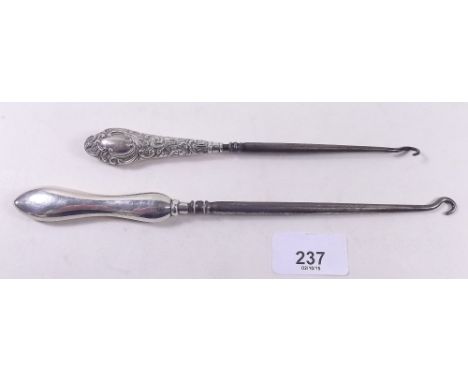 Two silver handled button hooks