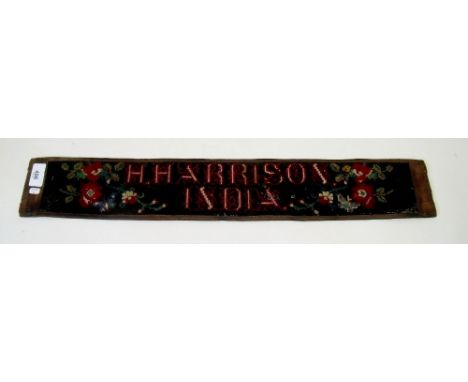 A 19th century Berlin woolwork panel on leather sash 'H Harrison India' - 60cm