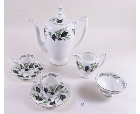 A Coalport coffee set decorated ivy leaves comprising: six cups and saucers, coffee pot, milk and sugar 