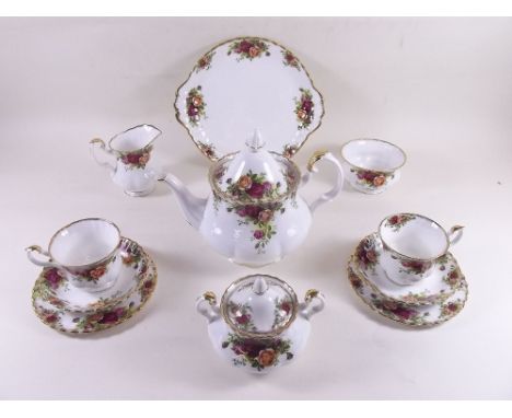 A Royal Albert Country Roses teaset comprising: teapot, six cups and saucers, six tea plates, two cake plates, open sugar, co