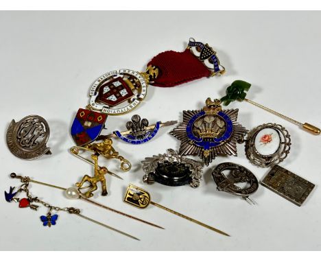 A paste pearl mounted stick pin, a gilt metal ape bar brooch with suspended ape, a silver Committee, 1953-55 Masonic badge, a