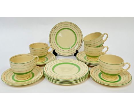 Clarice Cliff for Newport Pottery, a green painted and gilt part tea service comprising five cups (h- 7.5cm), six saucers, an