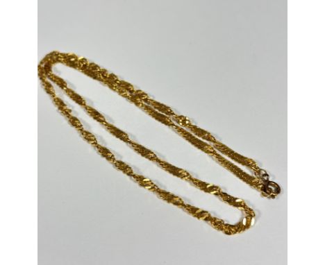 An Eastern style yellow metal spiral twist chain necklace with metal clasp fastening, unmarked (24cm) (12.82g)