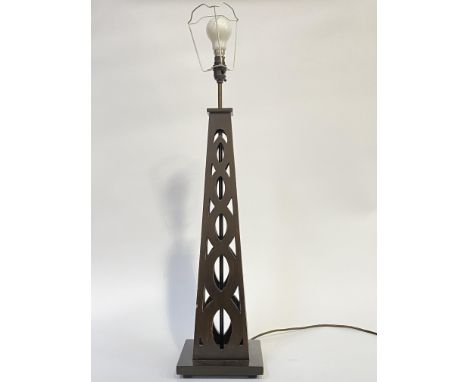 A large stained wood table light of pierced obelisk form, on a square base, (H72cm excluding bulb) together with a decorative