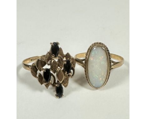 A 9ct gold oval opal ring with water opal mounted in rubover and rope pattern setting (Q) (2.0g) and a 9ct gold textured ring