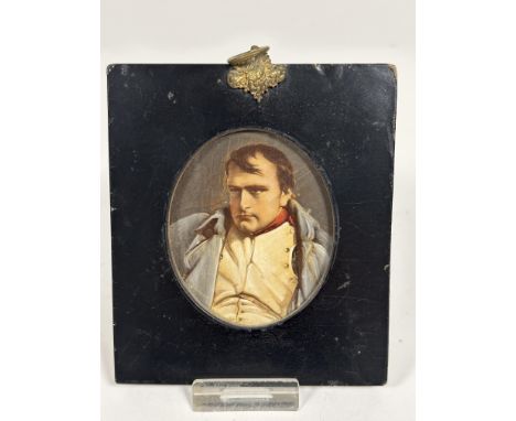 An early 19thc papier mache portrait miniature frame with overpainted print of Napoleon with gilt metal vine leaf and fruit m