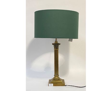 An Edwardian brass Corinthian column table light, with well cast acanthus capitol over fluted and reeded stem, on a stepped s