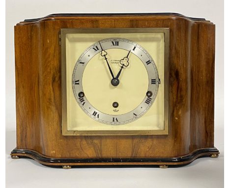 An Elliott Art Deco period walnut cased mantel clock, the silvered dial with Roman chapter ring inscribed by retailer R.L.Chr