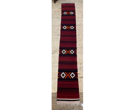A long flatweave kilim runner rug of geometric and lineal design 424cm x 58cm